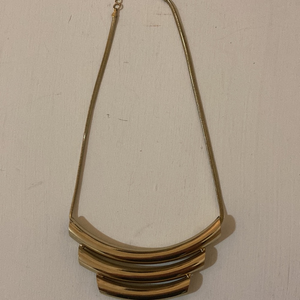 Bold gold colored statement necklace